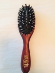 natural hair brush, red varnished beechwood, 7 rows of natural boar's bristles mixed with plastic pins in cushion, 18 x 5 cm, Made in Germany. Great if you have tangled hair.